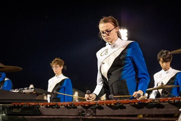 Brentwood High band members play on the football field